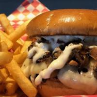 Swiss Burger · Topped with melted swiss cheese, grilled mushrooms and caramelized onions with garlic aioli.