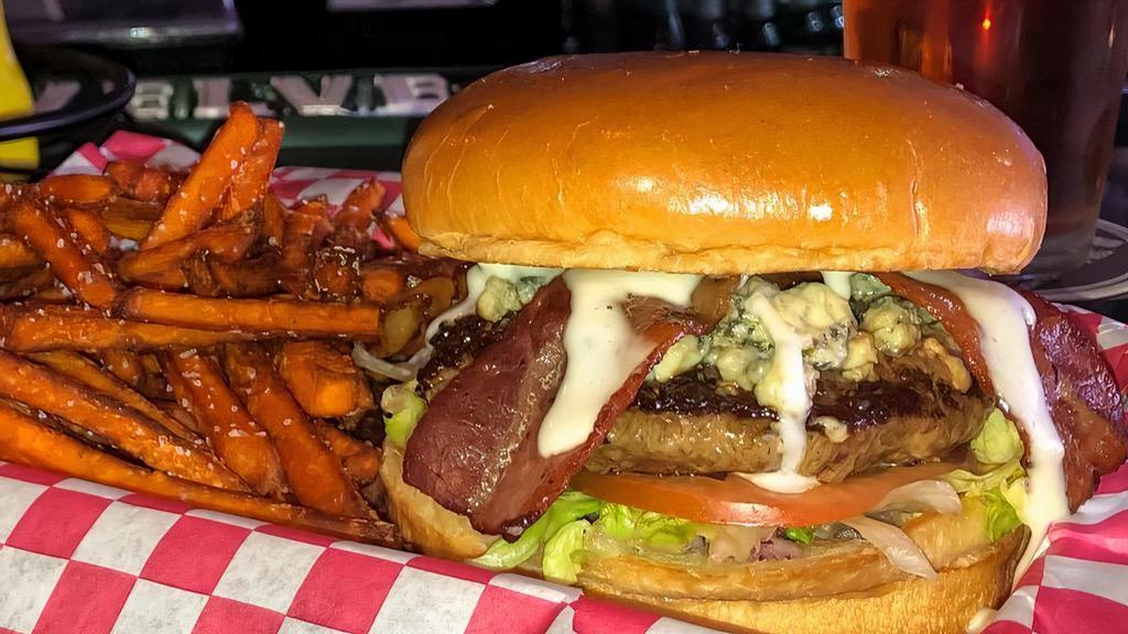 Bleu Burger · With creamy bleu cheese dressing, smoked bacon, lettuce, tomato, red onions and bleu cheese crumble.