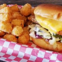 Fish Sandwich · Battered cod with lettuce red onions, pickles and tartar sauce on a brioche bun.