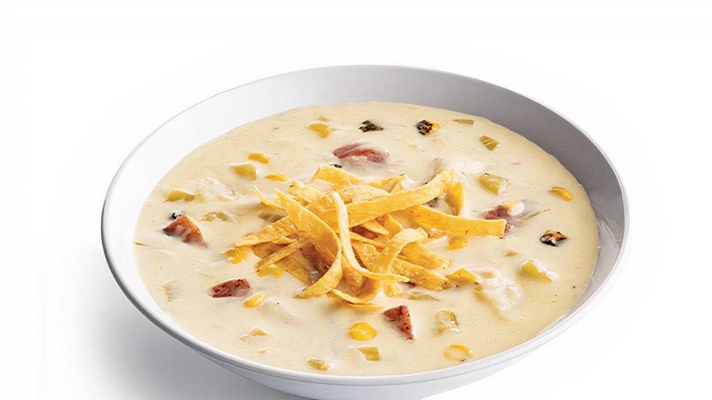 Southwest Potato & Green Chili · Red Skinned Potatoes, Green Chilies, Fire Roasted Corn, Green Cabbage, Chopped Bacon, Southwestern Spices & Fresh Cilantro In A Creamy Broth. Pictured With Tortilla Strips (+90 Cal).