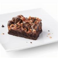 Caramel Rockslide Brownie · Layers of chewy brownie and buttery caramel, topped with crunchy toasted pecans