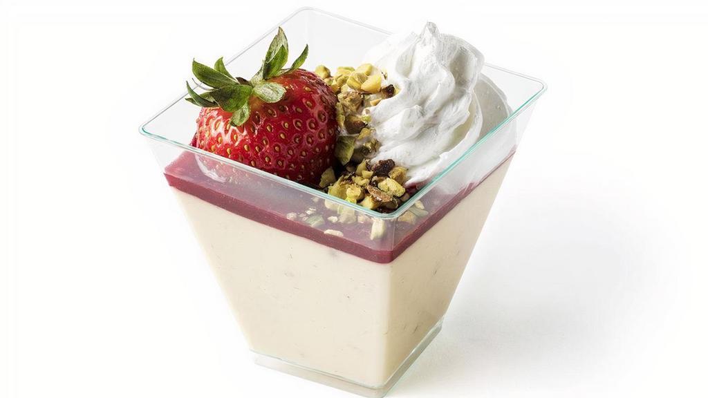 Fresh Strawberries And Cream Crème Brûlée · Whole fresh strawberries blended into vanilla bean custard topped with sweet raspberry coulis, a strawberry, chopped pistachios and whipped cream