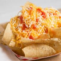 Small Strips · Freshly made corn tortilla chips served with shredded cheese & our famous sauce.