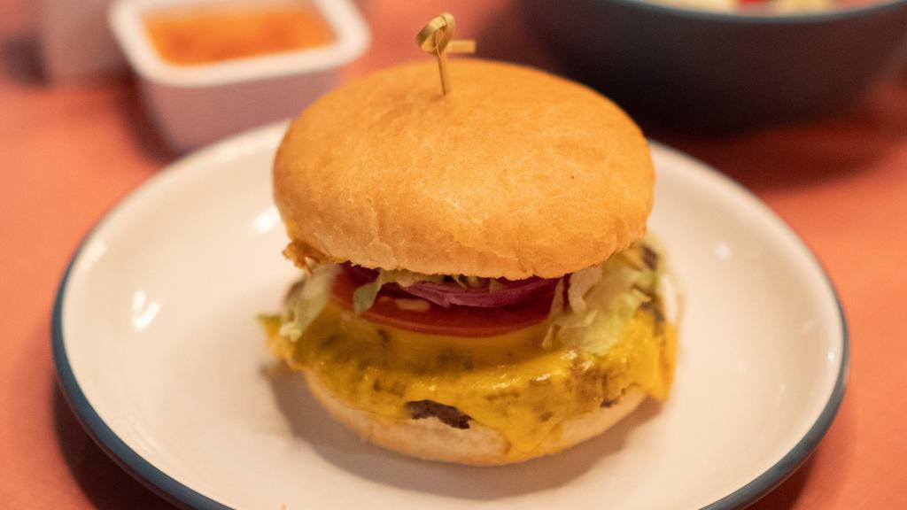 Cheeseburger · shredded iceberg, tomato, red onion, jalapeño mayo, american cheese