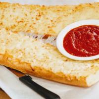 Cheese Garlic Bread · Our garlic bread covered in mozzerella, served with meat or mushroom marinara sauce.