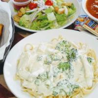 Fettuccini Alfredo Pasta · With a white cream sauce and parmesan cheese
