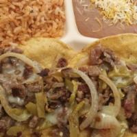 Two Taco Loco Platter  · Your choice of meat, Grilled onion, Anaheim peppers and melted cheese , corn or flour tortil...
