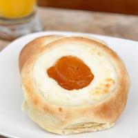 Peaches And Cream · Homemade peach jam and house cream cheese filling. All atop of our tender, buttery, yeasty a...