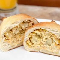 Egg And Cheese · No meat. Hand cracked eggs and creamy cheese. All stuffed inside of our tender, buttery, yea...