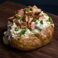 Chicken Baked Potato · Jumbo baked potato filled with a creamy blend of butter, sour cream, cheddar cheese, bacon, ...