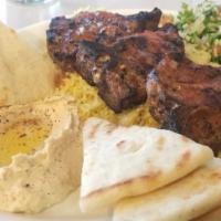 Lamb Chops* · Marinated Lamb chops grilled over open flame