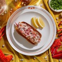 Classic Maine Lobster Roll · Fresh lobster tossed with creamy mayo, fresh chives, and lemon on a buttery toasted bun.