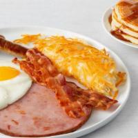 Ultimate Breakfast · 2 bacon strips, 2 sausage links and grilled ham steak. served with 2 eggs, any style, choice...