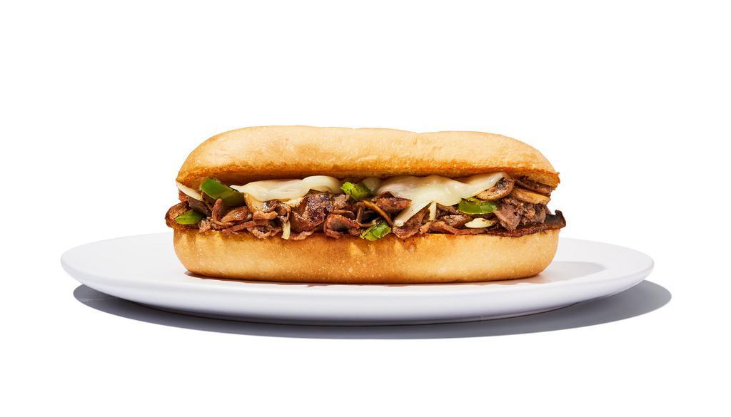 Philly Cheesesteak Sandwich · Yo, Adrian ... I made you a sandwich! Steak or chicken topped with sautéed onions, green peppers, mushrooms and provolone cheese and served on a hoagie roll. Served with side.