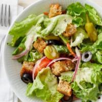House Salad · Romaine lettuce, cucumbers, tomatoes, red onions, black olives, banana peppers with lemon ci...