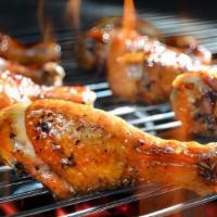 Garlic Pepper Grilled Chicken · Three pieces of tender and delicious grilled chicken legs/wings in a house garlic and pepper...