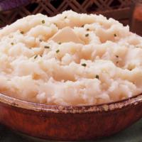 Mashed Potatoes & Gravy · Creamy homemade mashed potatoes with heavy cream and butter with a savory gravy.