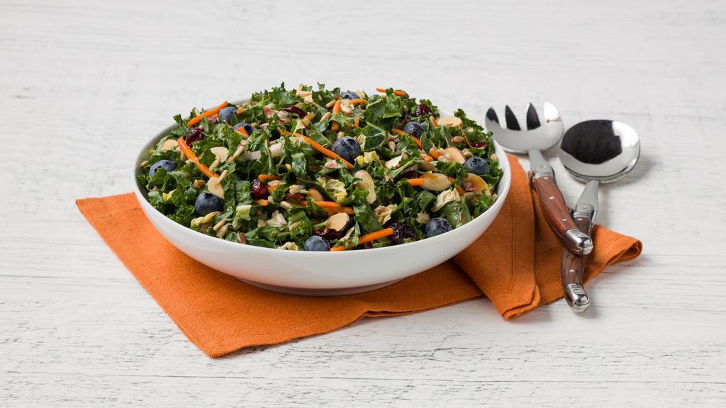 Super Food Kale Salad (1 Lb.) · Kale, blueberries, cabbage, shredded carrots, dried cranberries, roasted sunflower seeds, red onion, and almonds tossed with a pomegranate blueberry vinaigrette.