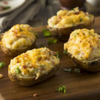 Twice Baked Potato · Potato filled with creamy potatoes mixed with Bacon and Cheddar Cheese.