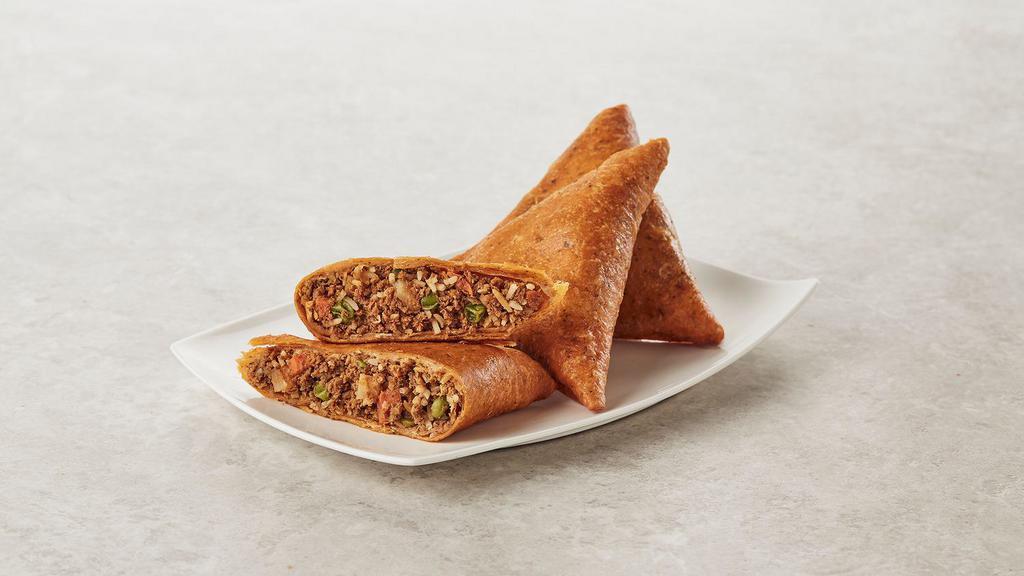 Samosa Butter Chicken · Chicken with rice and vegetables in our legendary butter chicken seasoning inside a crispy pastry.