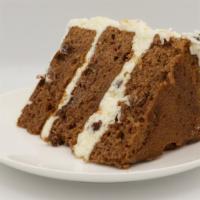 Colossal Carrot Cake Slice · 3 layers of moist Carrot Cake filled and frosted with a Cream Cheese icing mixed with raisin...