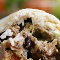 Carnitas Burrito · flour tortilla wrapped with refried beans, mexican rice and Carnitas (Pork)
