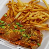 Curry Wurst · Grilled house recipe Bratwurst topped with our signature curry-tomato sauce and served with ...