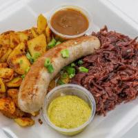 Bratwurst · Grilled house recipe Bratwurst served with pan fried potatoes, German red cabbage and brown ...