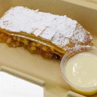 Homemade Strudel - Apple · Homemade apple strudel with vanilla sauce. Contains nuts