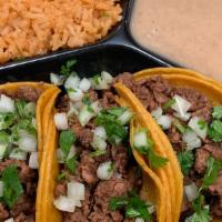 Taco Combo  · 3 TACOS MEAT OF CHOICE  WITH GUAC AND ONION CILATRON
SIDE OF RICE AND BEANS AND SALSAS ON TH...