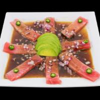 Sashimi · Tuna, garnished with Soy Sauce, Spices,
Avocado, Serrano Peppers and Red Onions