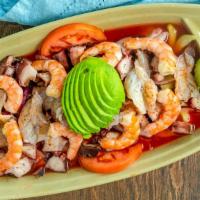 Aguachile C/ Clamato · Raw shrimp, octopus, cooked shrimp, onion, cucumber, avocado, tomatoes, and clam juice.

Tho...