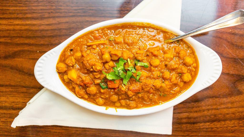 Channa Curry · Garbanzo beans cooked in traditional curry. V-GF-NF