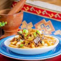 Steakhouse Poutine · Gravy, cheese curds, donair meat, sauteed onion and mushroom, green onion.