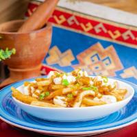 Traditional Poutine · Gravy, cheese curds, green onion.