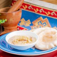 Hummus With 3 Small Pitas · Traditional hummus served with 3 small pitas