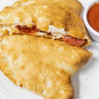 Calzones · Pizza pocket stuffed with mozzarella cheese, ricotta cheese and your choice of two toppings....