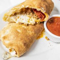 Stromboli · Pizza dough rolled with your favorite toppings and our 100% mozzarella cheese baked to perfe...