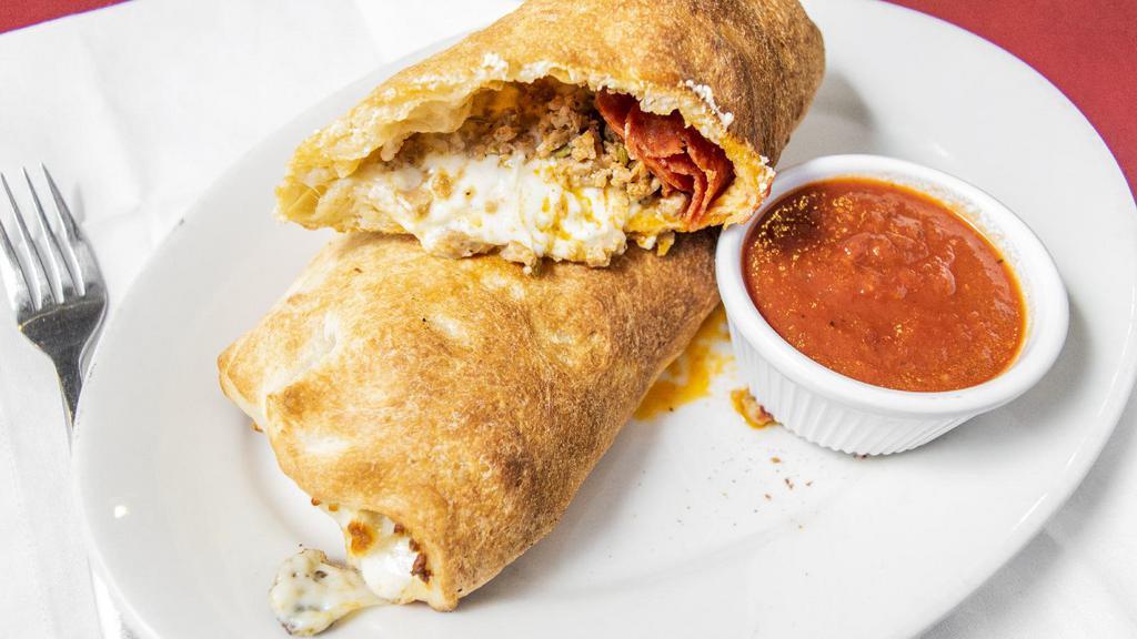 Stromboli · Pizza dough rolled with your favorite toppings and our 100% mozzarella cheese baked to perfection. Includes side of sauce.