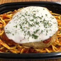 Chicken Parmesan Meal · Italian breaded chicken breast topped with provolone cheese on a bed on linguinie in roasted...