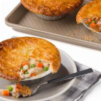 Chicken Pot Pie · Store roasted chicken in a creamy sauce with potatoes, carrots, peas, onions topped with ten...