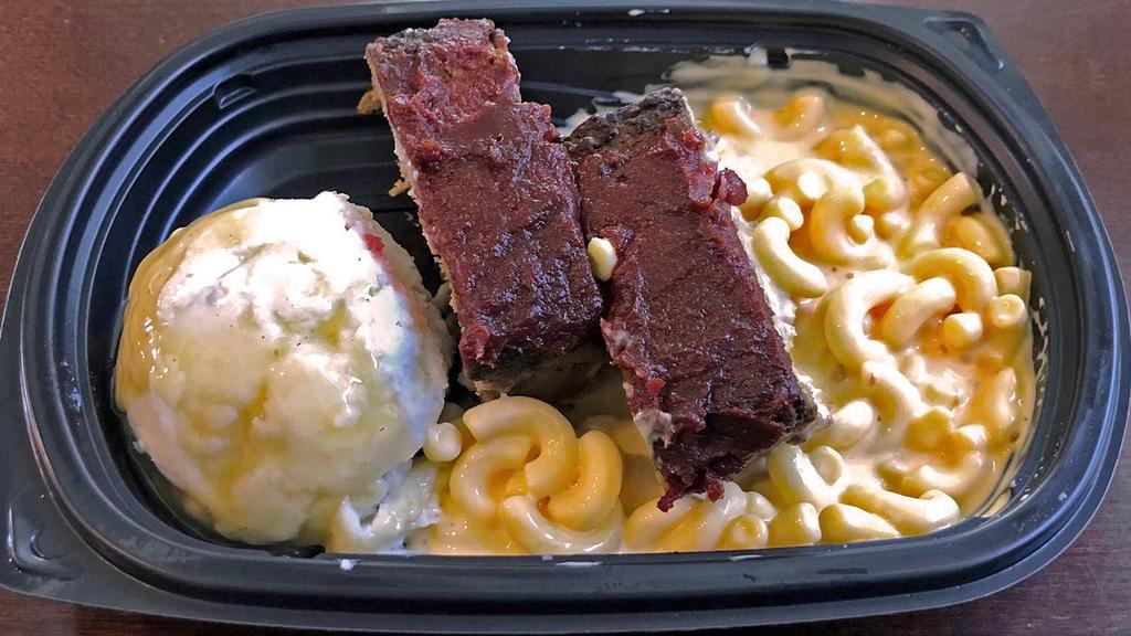Meatloaf, Mac & Cheese Meal · Beef meatloaf with mashed potatoes, gravy, and creamy macaroni and cheese.