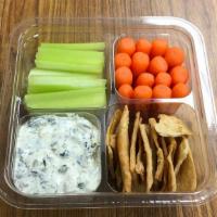 Deli Snack Spinach Dip · Spinach dip, baby carrots, celery, and Stacy's pita chips.