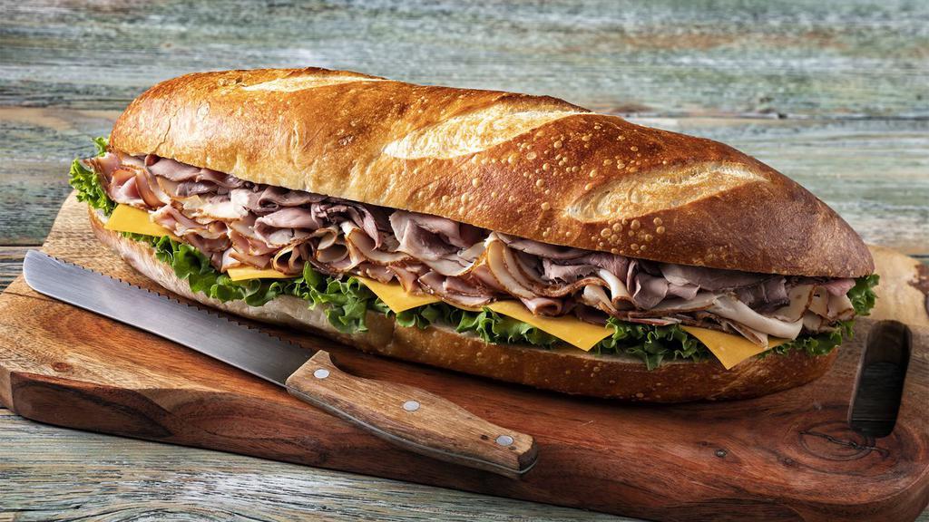 All American Super Sub Sandwich · Turkey breast, honey ham, roast beef, cheddar, and leaf lettuce on French bread. No substitutions.