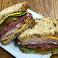 The Stacker · Honey ham, roast beef, oven roasted turkey, mild cheddar cheese, with lettuce, tomato, red o...