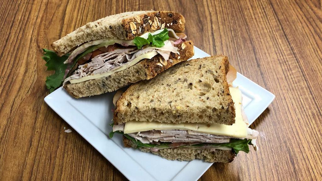 Cranberry Turkey · Store roasted turkey, havarti cheese, red onion, lettuce, tomato with a cranberry mayo dressing on multi-grain bread.