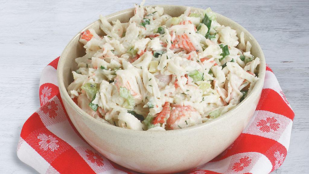 Seafood Salad · A tasty blend of creamy and crunchy with chunks of imitation crabmeat, chopped celery, white onion, and a classic mayonnaise dressing.