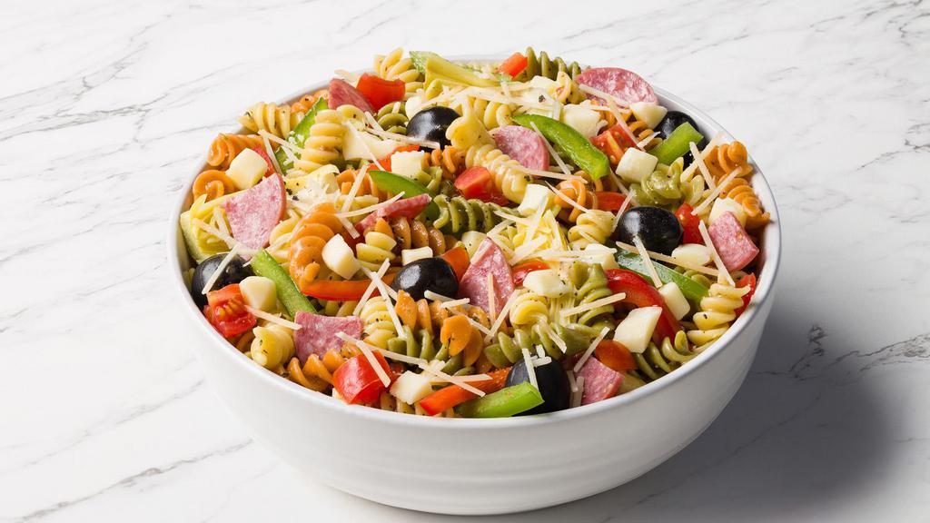 Antipasto Salad · Tri color rotini pasta, Genoa salami, provolone, tomatoes, black olives, artichoke hearts, and Parmesan in a milanese vinegarette.