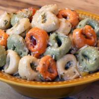 Cheese Tortellini Pasta Salad · Tri-color cheese tortellini, diced cucumbers, red and yellow bell peppers, and green onions ...
