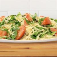Lemon Capellini With Arugula · Capellini pasta is tossed with chopped tomatoes, capers, arugula, garlic, and parsley in a l...